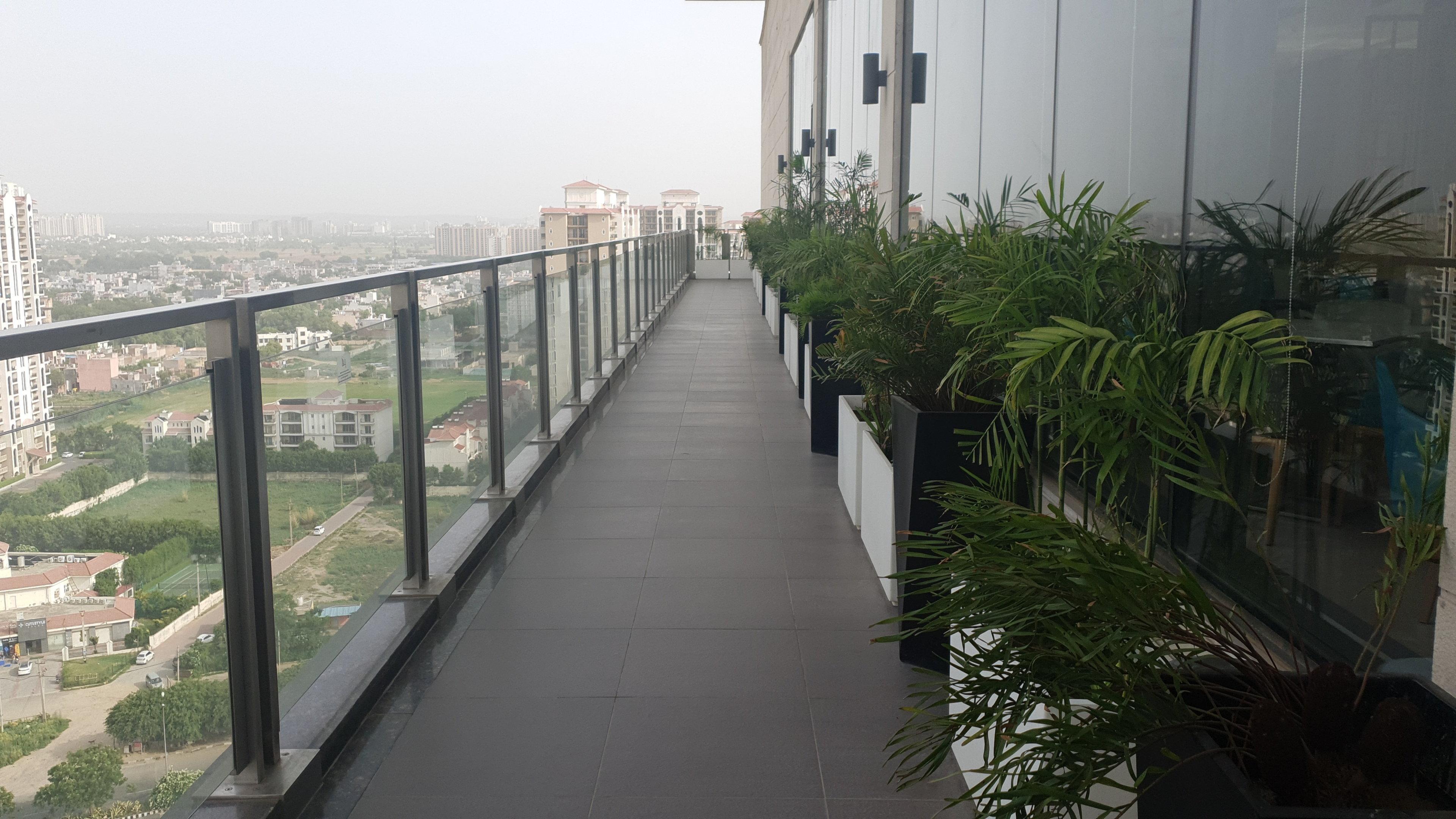 Holiday Inn Gurugram Sector 90 By Ihg Гургаон Экстерьер фото A balcony in a residential building in India