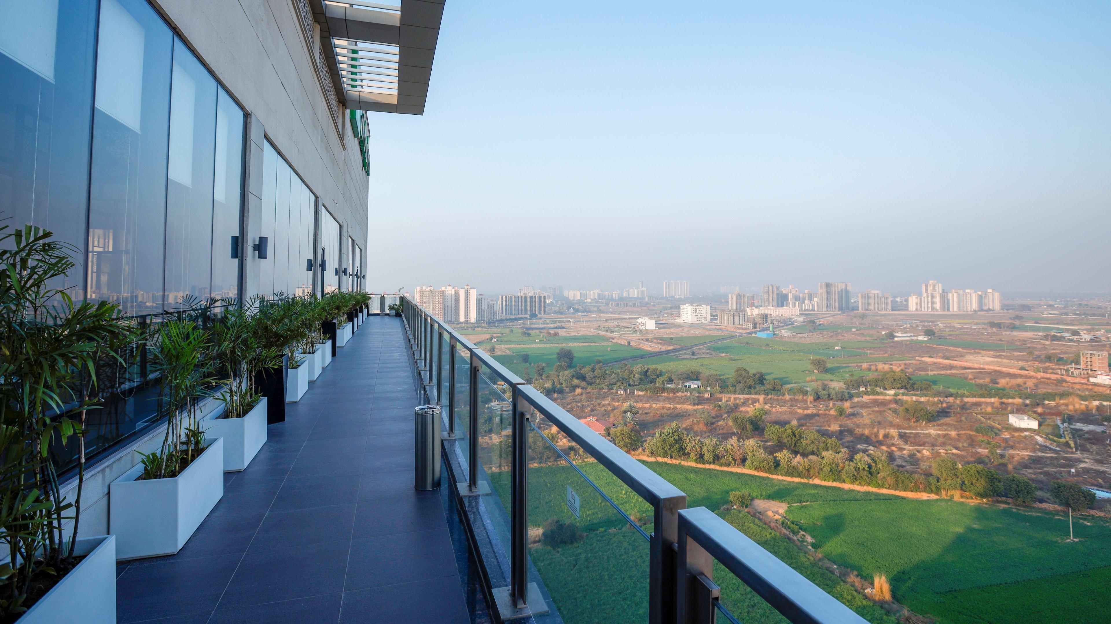 Holiday Inn Gurugram Sector 90 By Ihg Гургаон Экстерьер фото View from the balcony of a residential apartment