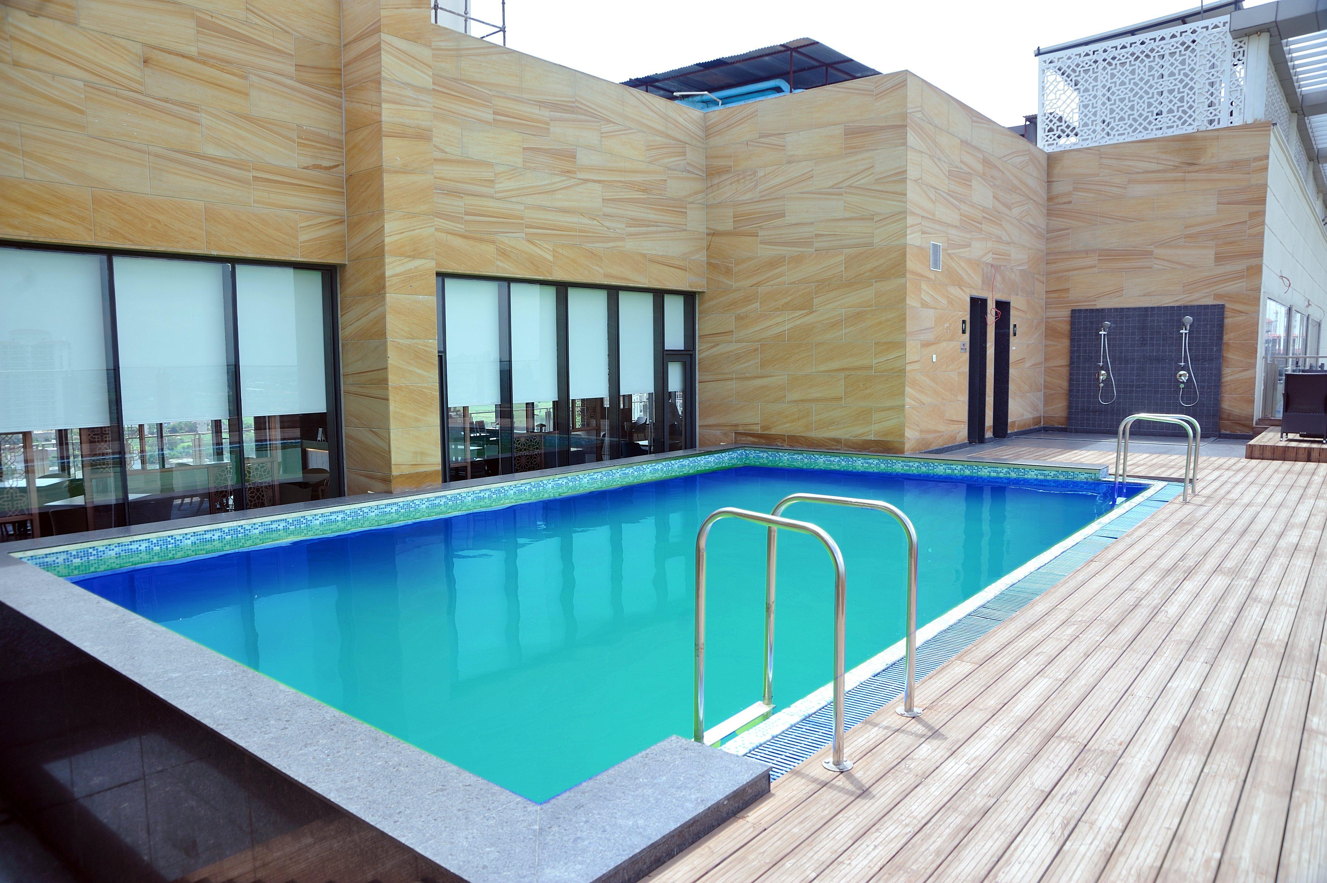 Holiday Inn Gurugram Sector 90 By Ihg Гургаон Экстерьер фото Swimming pool at the hotel